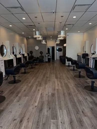 Modern hair salon with styling chairs and round mirrors